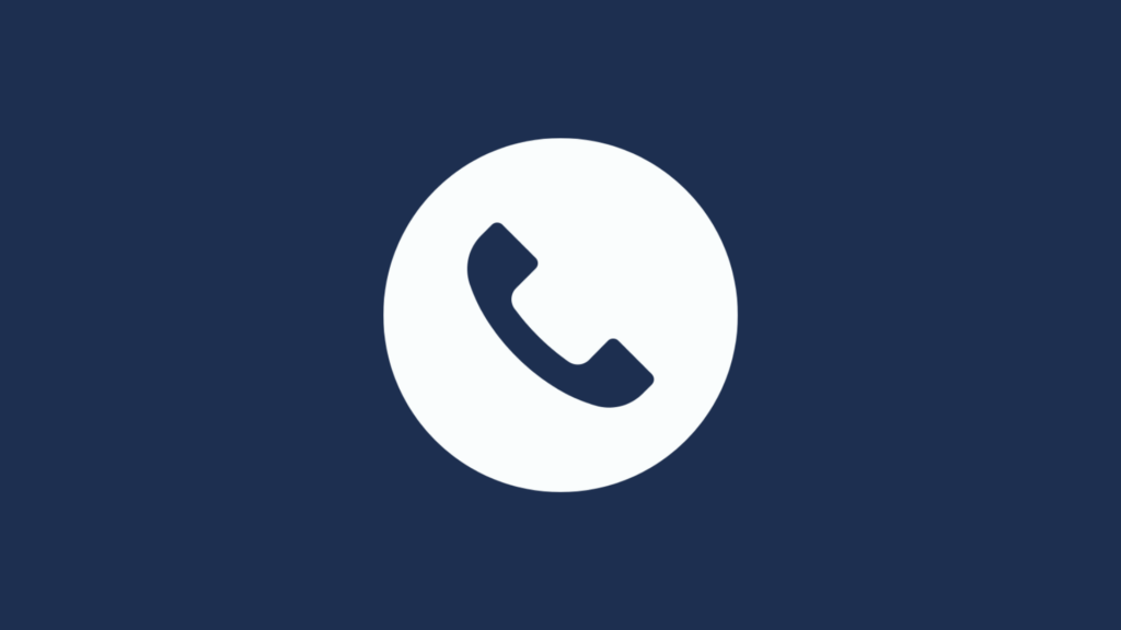 Phone Icon Image: A simple white icon of a telephone handset centered on a deep blue background.
